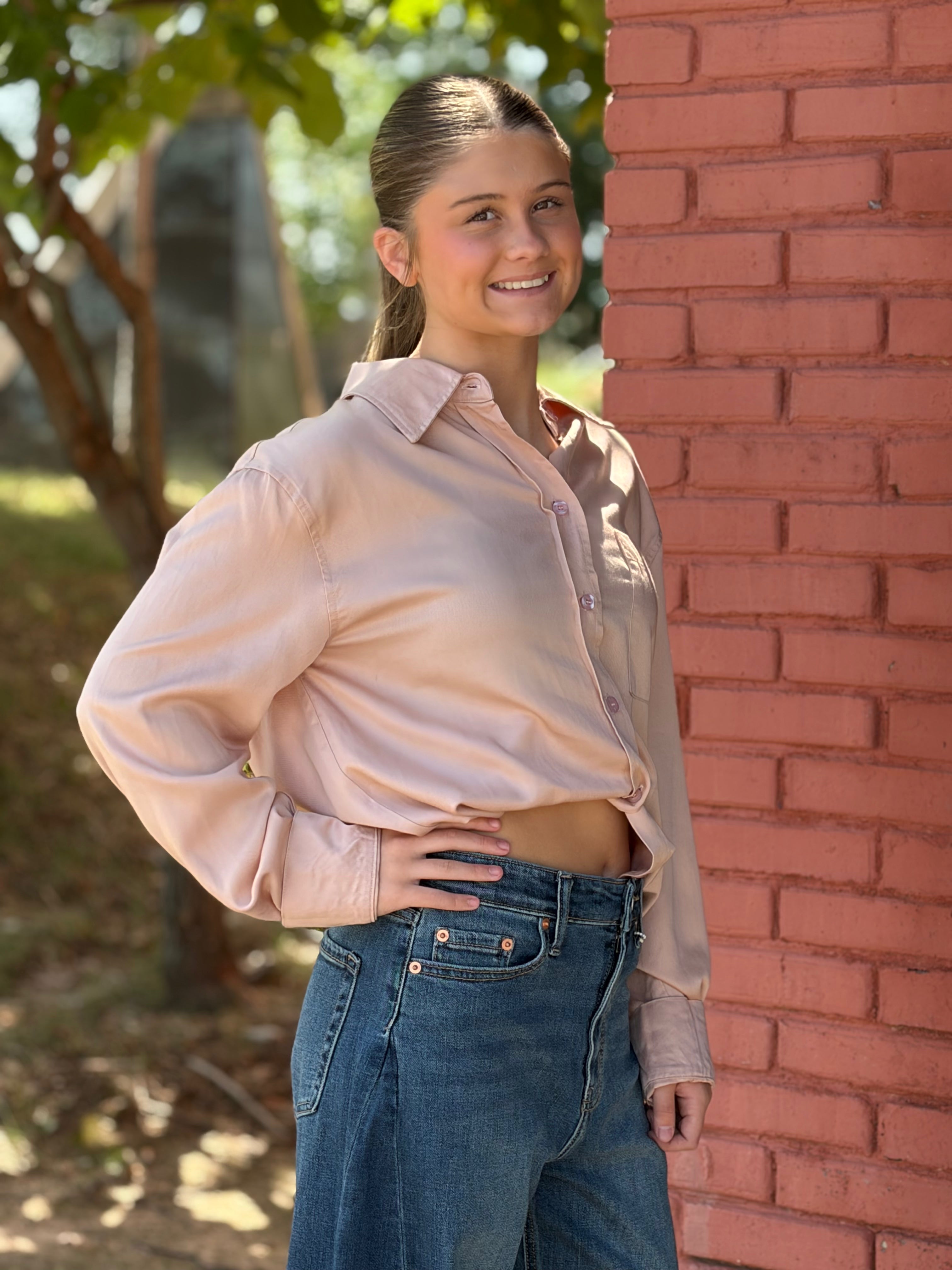 Three-quarter side, hand on hip showing relaxed fit