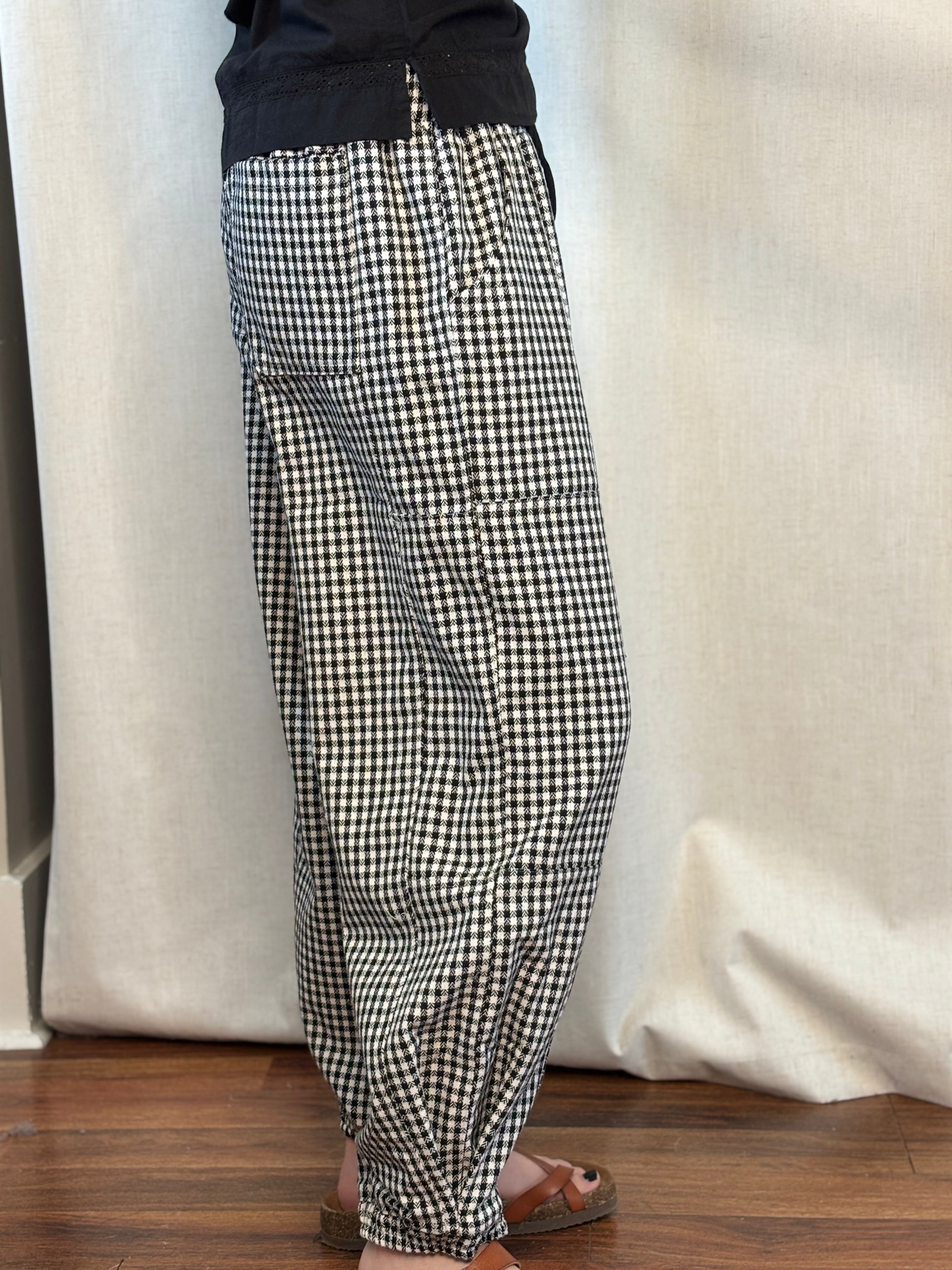 Side view of NOABOA Mini Plaid Cuffed Barrel Pants showing barrel-leg shape, elastic waistband, and cuffed ankle hem