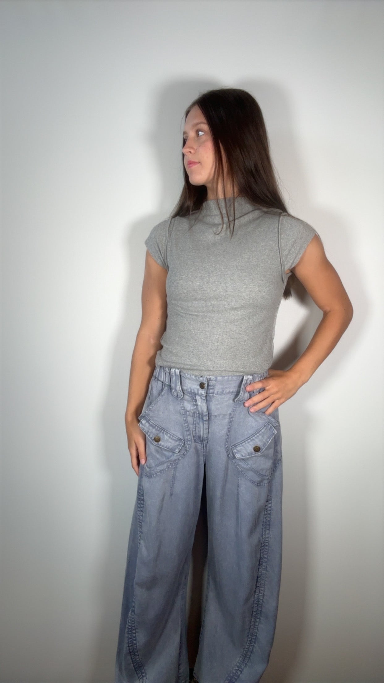 front-facing shot with flap pockets and elastic waist visible