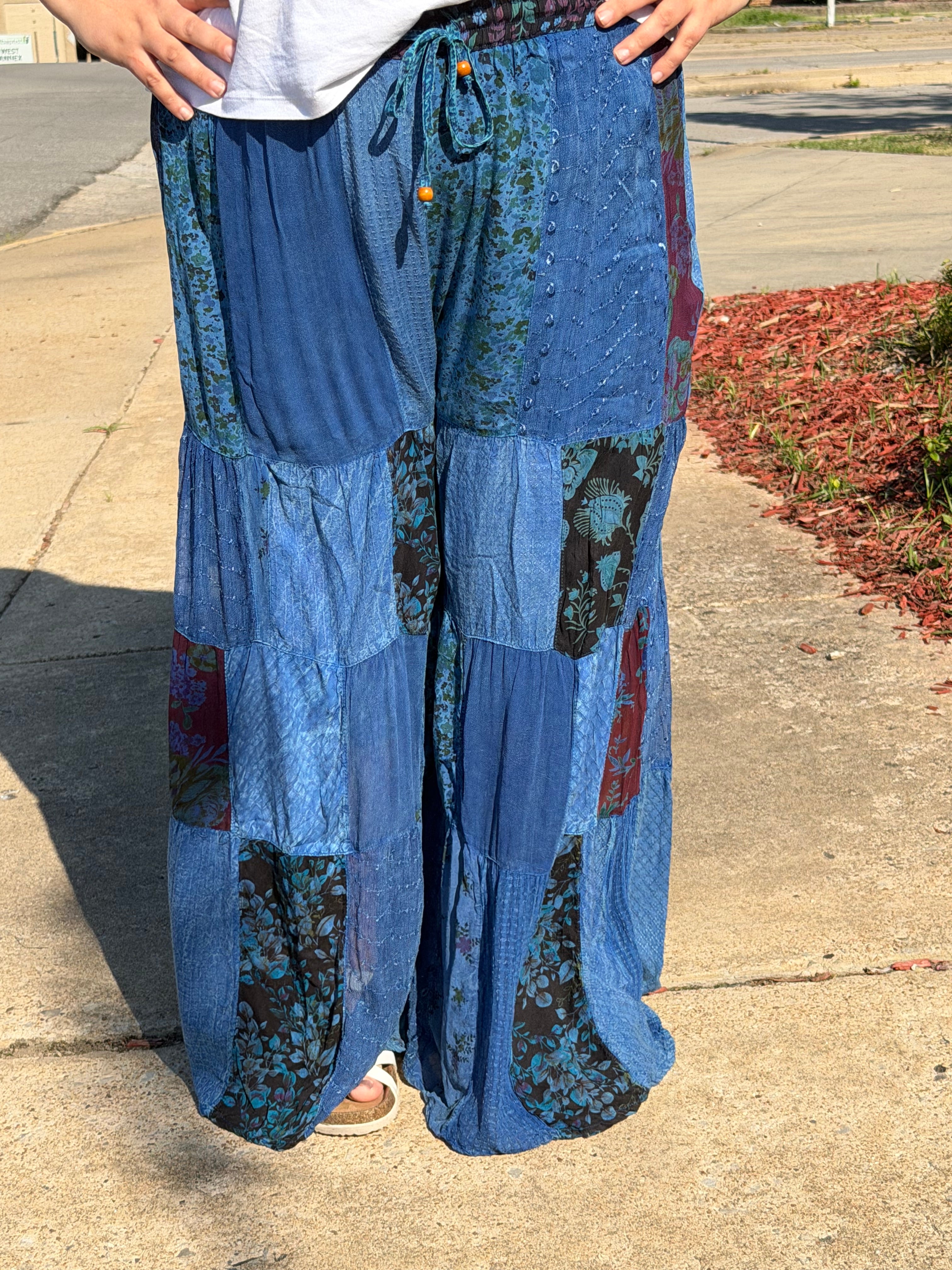 Woman wearing indigo patchwork bottoms