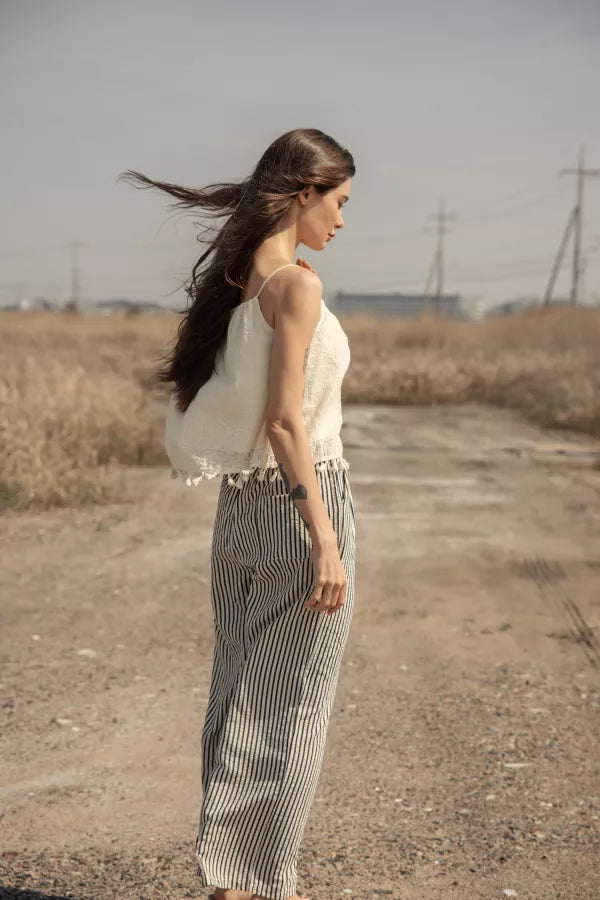 Woman wearing a cream crochet crop top