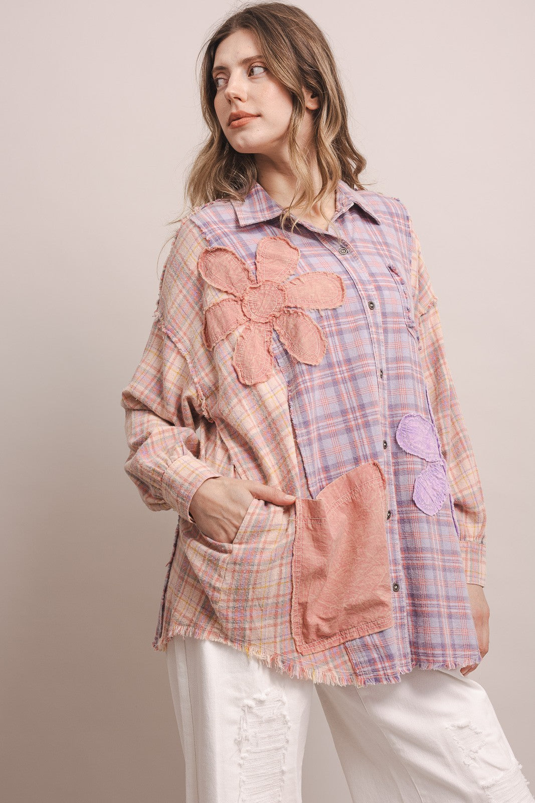 Side view, large pink flower appliqués, patch pocket, frayed hem