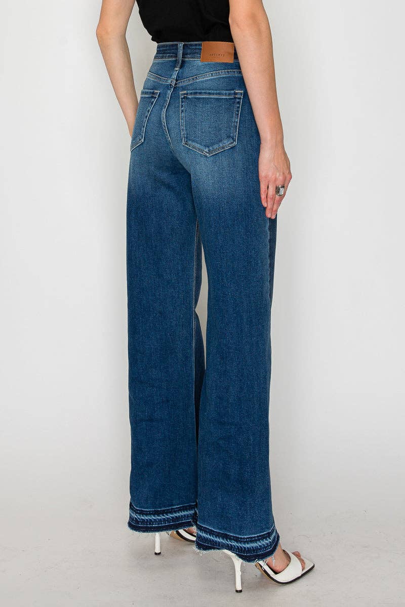 The Bridget flare jeans back view - high-rise waist with relaxed fit through hip and thigh transitioning to bold flare