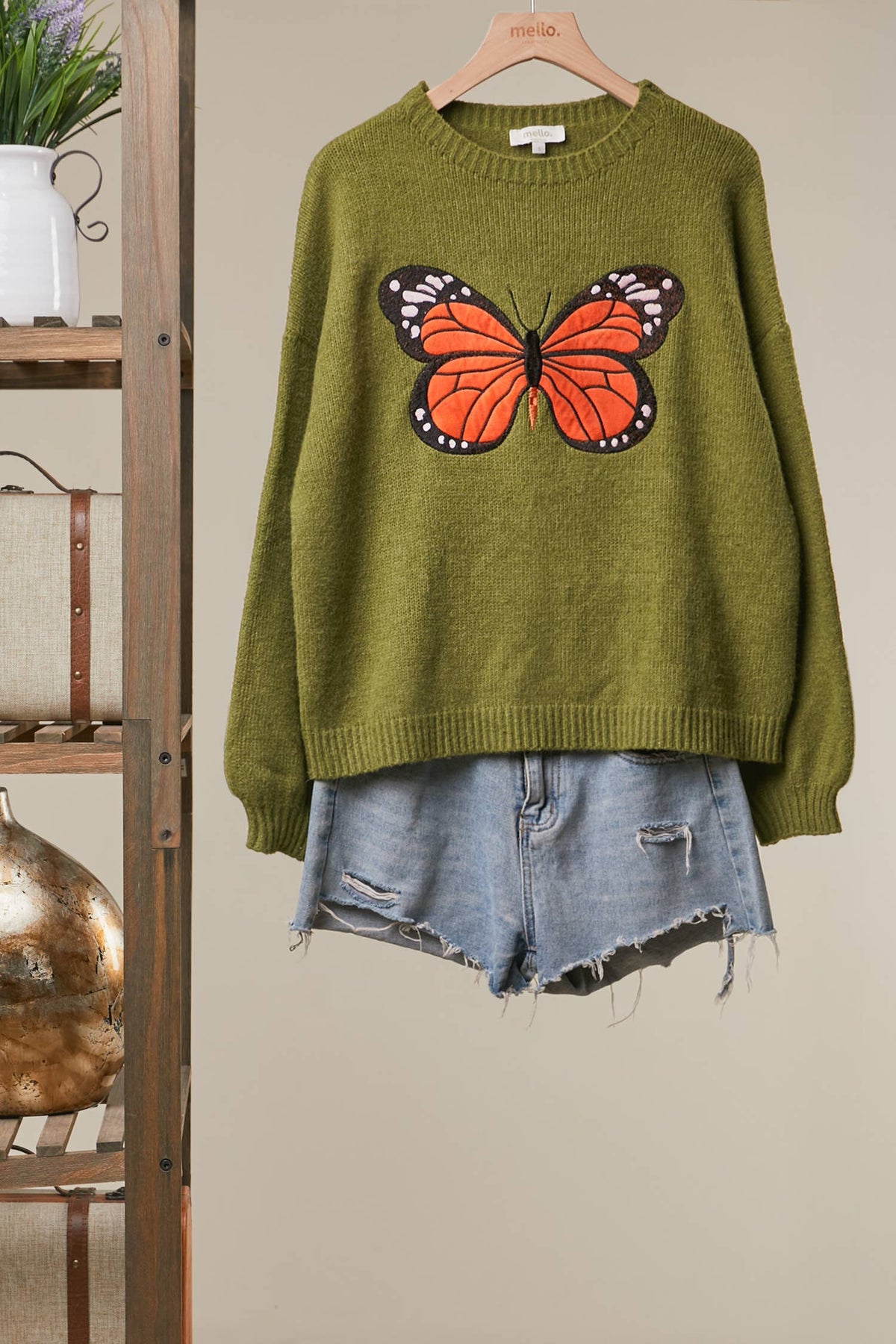 Mello Patchwork sweater Olive Green on Hanger with jeans