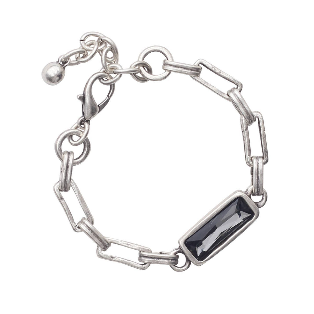 Silver bracelet with a black gemstone on a white background