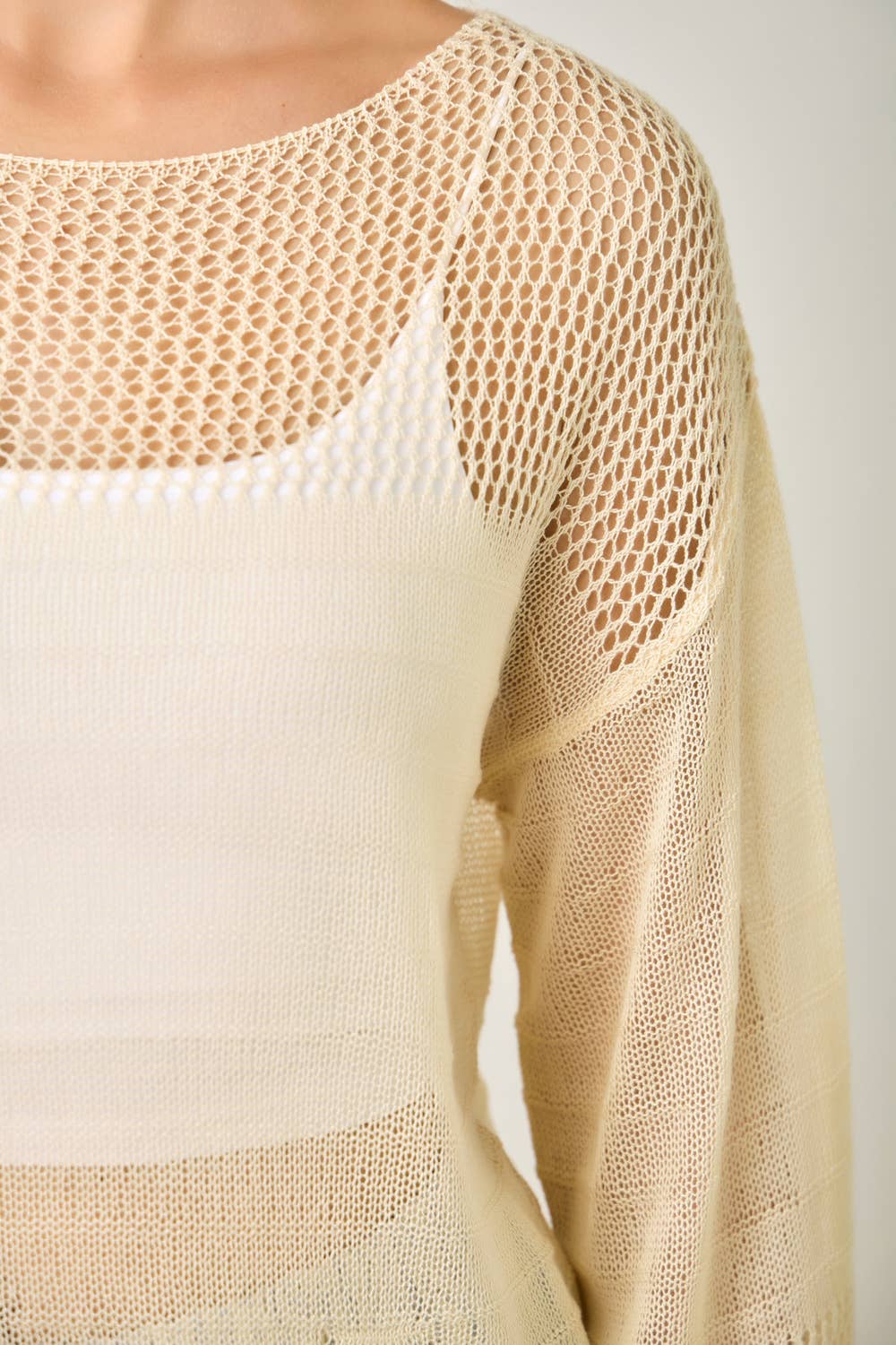 The Barely There Knit in Oatmeal - close-up of fishnet bell sleeve details