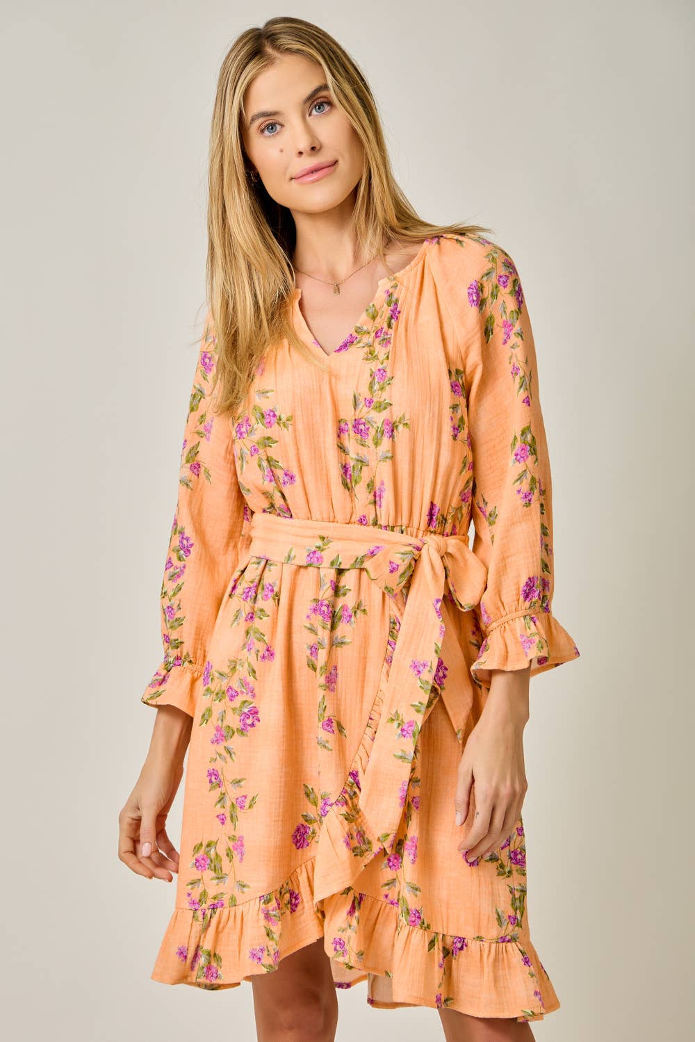 The Valencia Floral Wrap Dress - detail of adjustable waist tie and ruffle trim