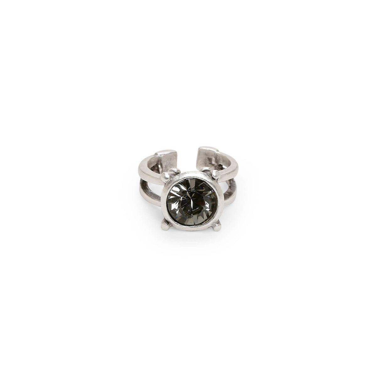 A silver-toned ring featuring a round, faceted dark gray gemstone in a prong setting, shown against a plain white background.