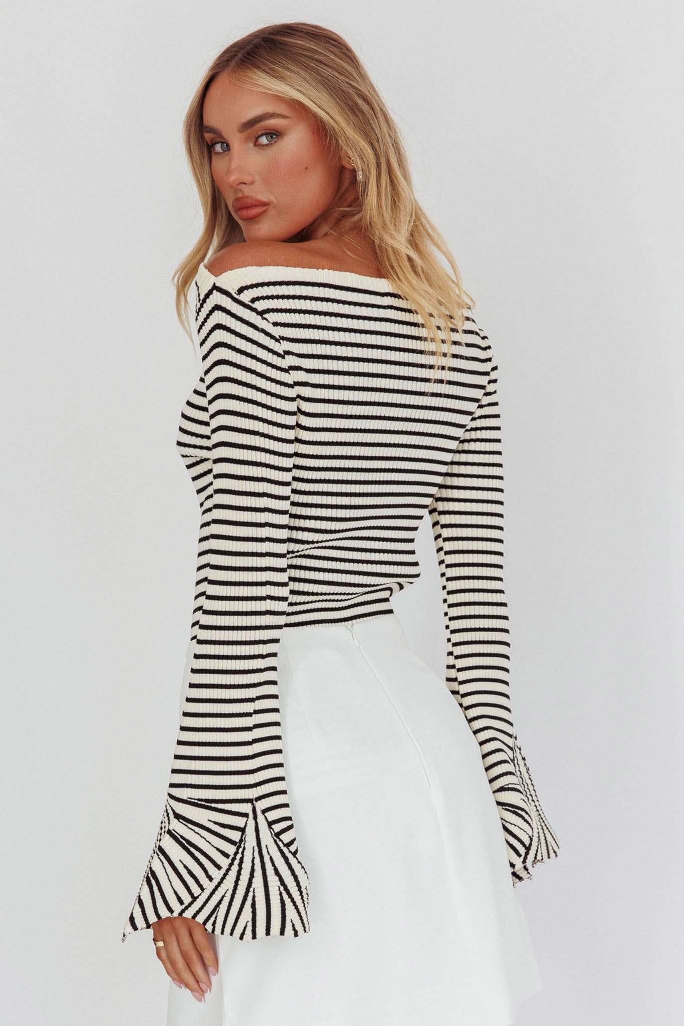 Black-and-ivory horizontal stripe sweater, ribbed, long sleeves with flare