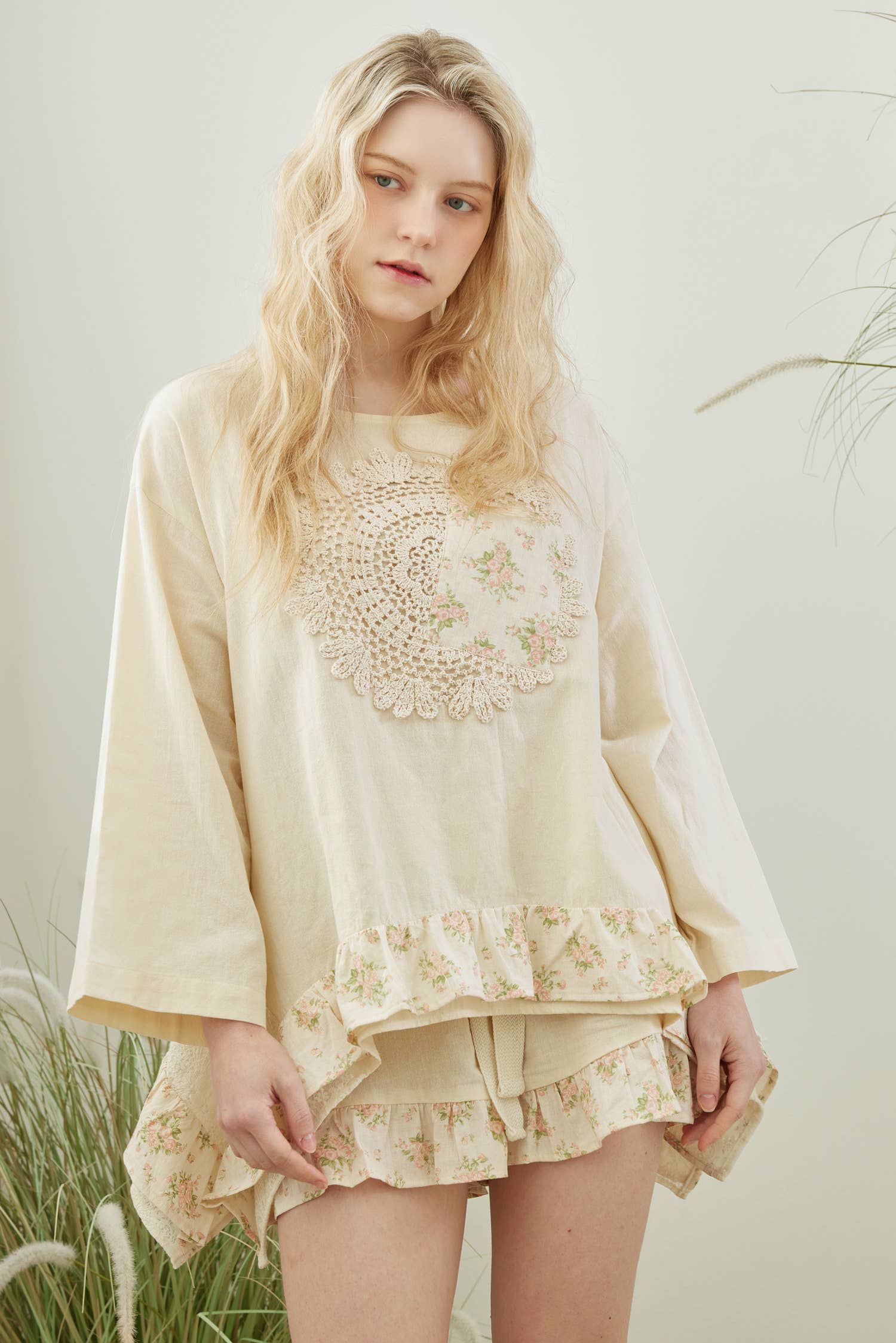 Wildflower Dreams patchwork top - front view showing oversized fit with artisanal patchwork and delicate crochet detailing