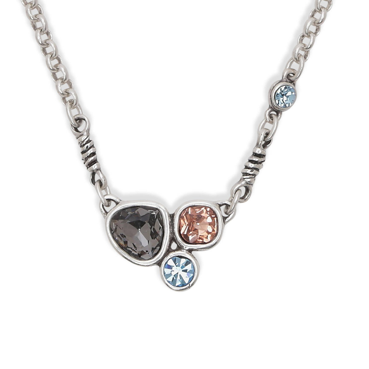 close up of multi gemstone and silver plated pewter statement necklace
