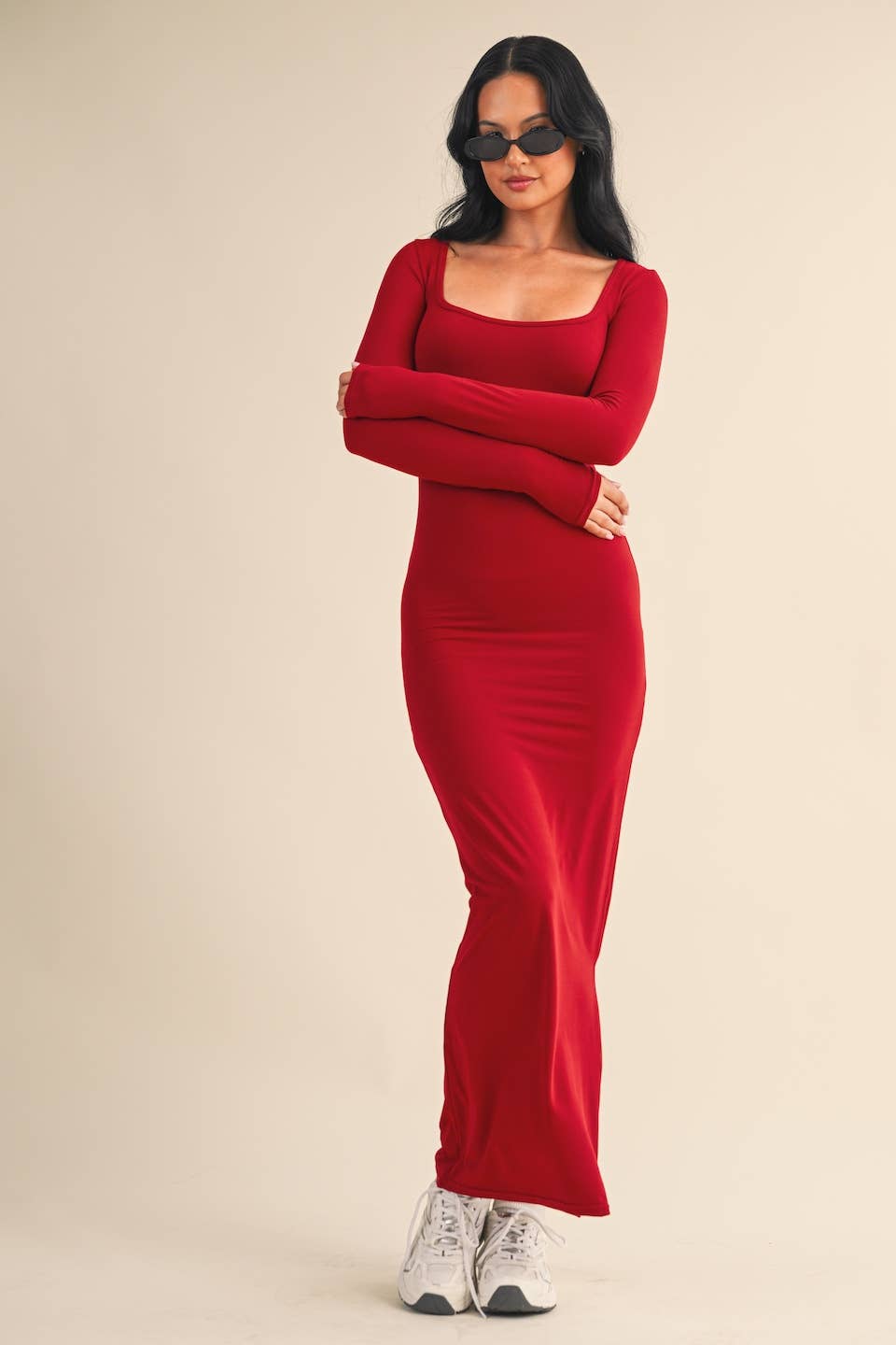 Woman wearing red square-neck long sleeve maxi dress in buttery knit fabric by Kimberly C.