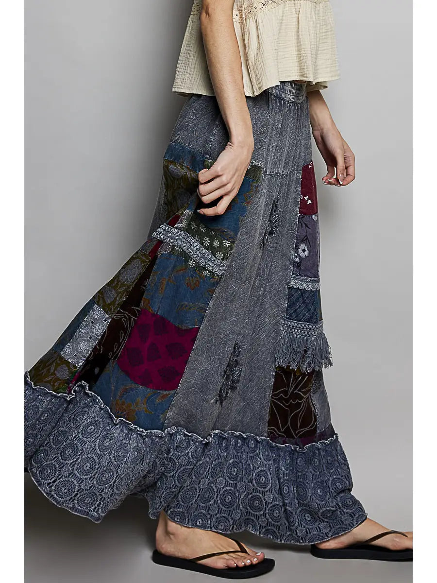 Side detail, mixed slate blue/burgundy/teal/olive panels, lace + fringe + ruffled hem