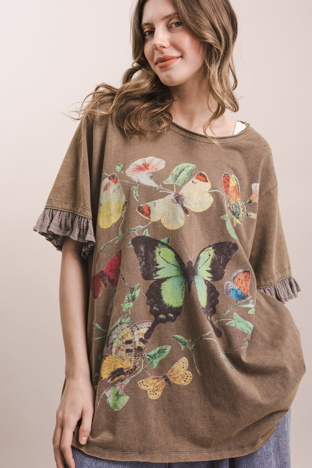 Mineral washed mocha butterfly print ruffle sleeve top — front view showing botanical butterfly graphic and contrast gauze frilled sleeves"
