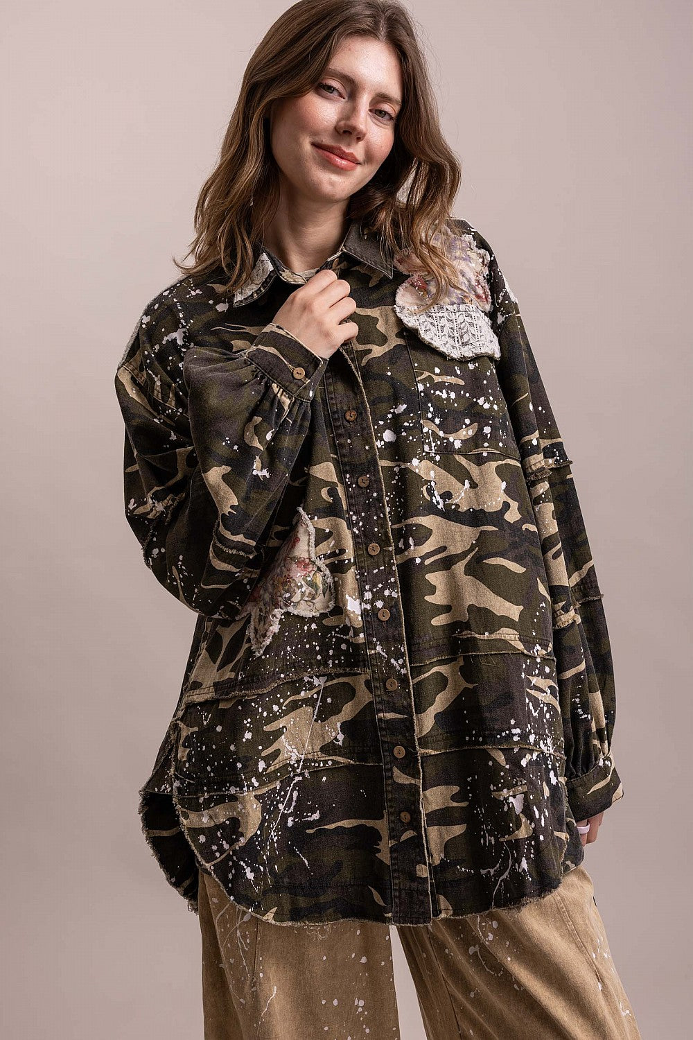 Front view of BlueVelevet camo patchwork jacket with floral appliques, lace-trimmed chest pockets and button cuffs.