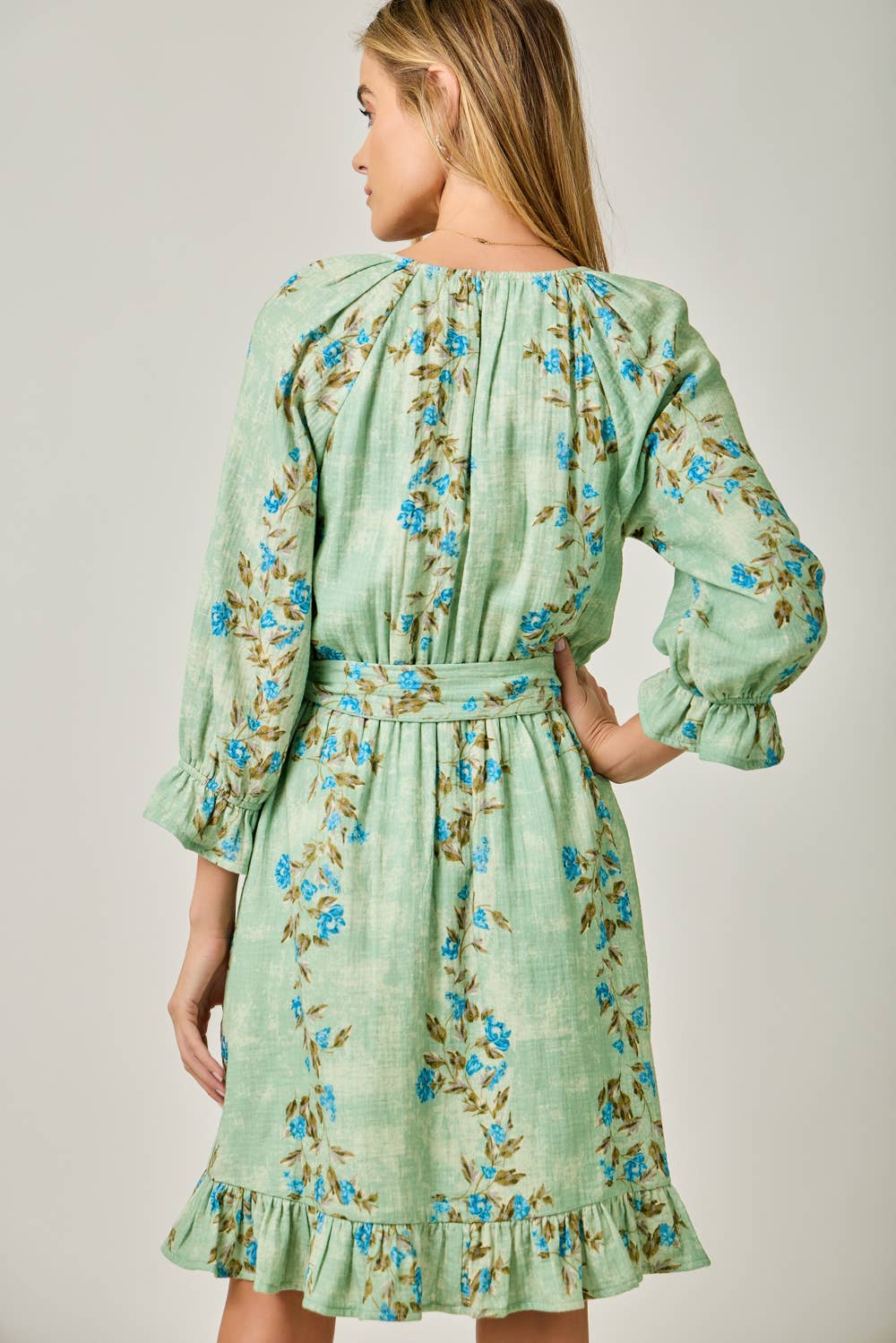 The Valencia Floral Wrap Dress - back view of wrap dress with ruffle accents