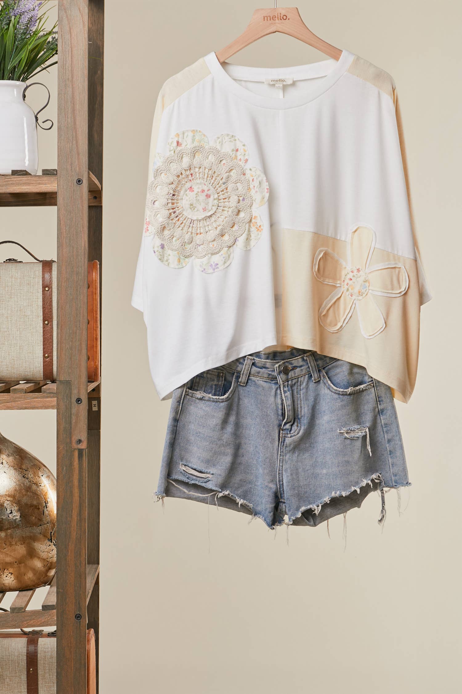 The Cleo Crochet Patchwork Top in Cream — oversized patchwork silhouette with crochet medallion patch and flower appliqué detail, boho-luxe ivory and cream colorblock top