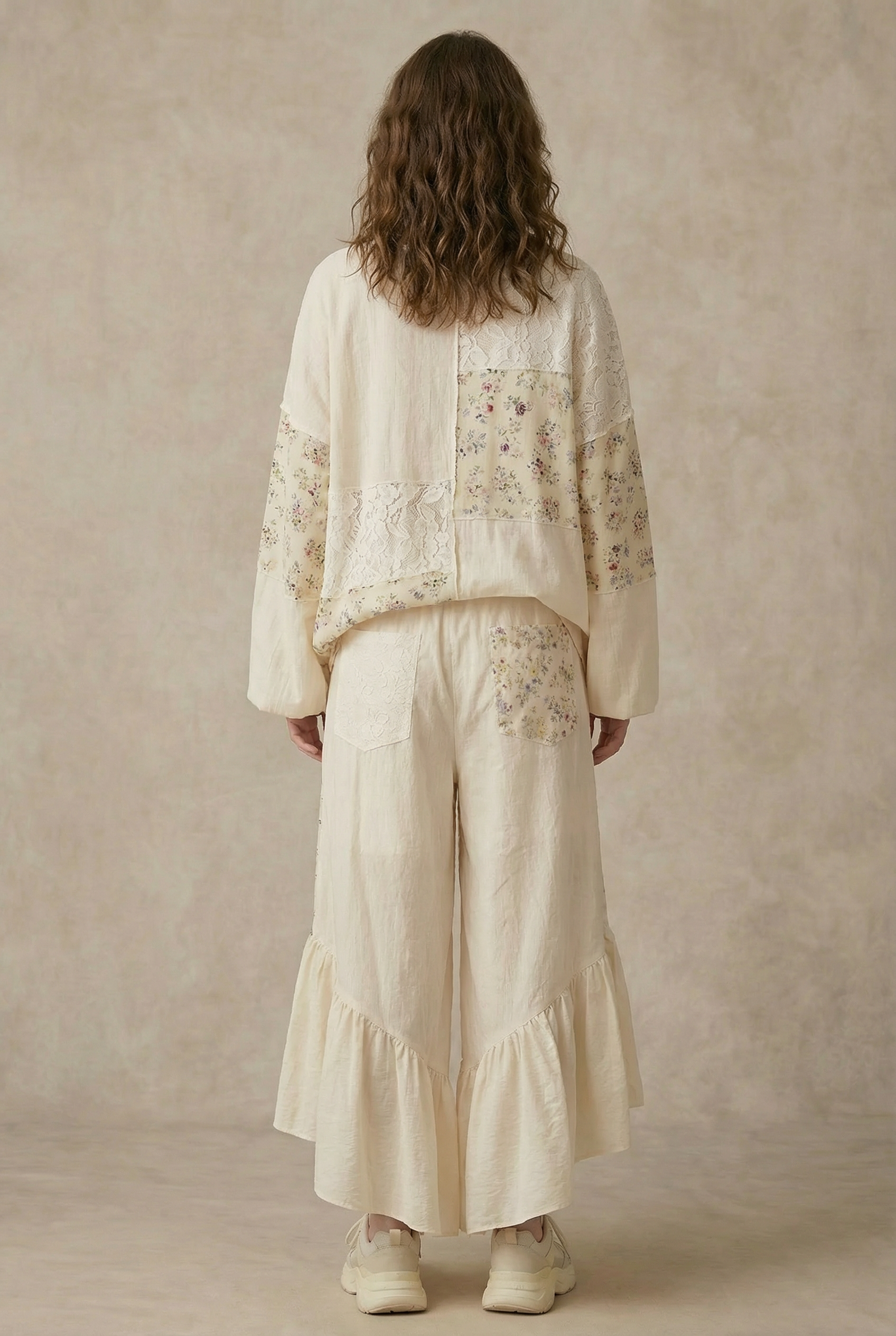 Boho ruffle pants back view - wide-leg silhouette with artisanal floral patchwork construction