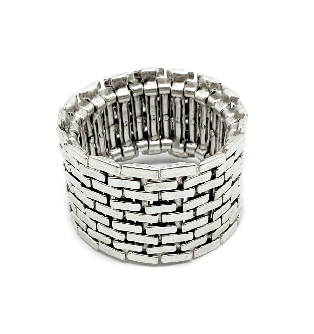 Silver woven bracelet on a white background