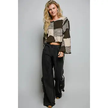Darling Patchwork Cropped Long-Sleeve top styled with wide-leg black pants
