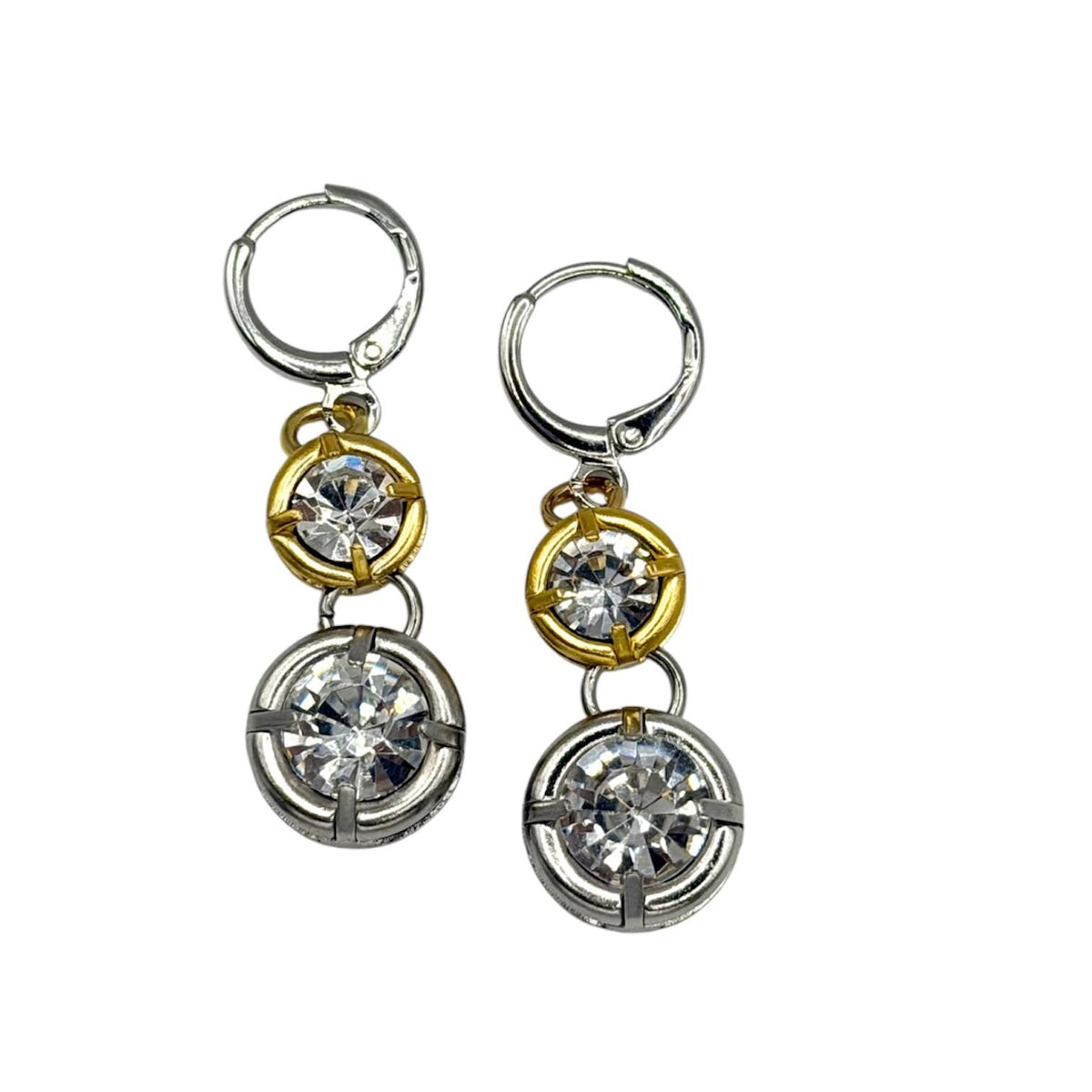 Pair of earrings with gold and silver circular designs on a white background