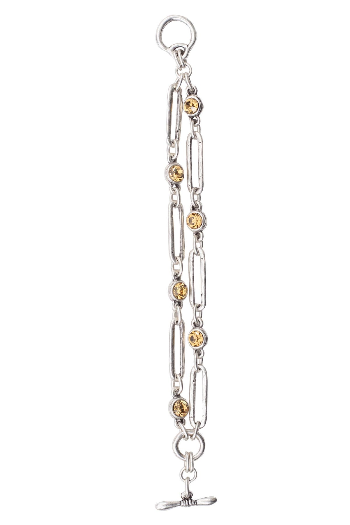 A silver-toned paperclip chain bracelet with small round gold-toned bead accents and a toggle clasp, shown against a plain white background.