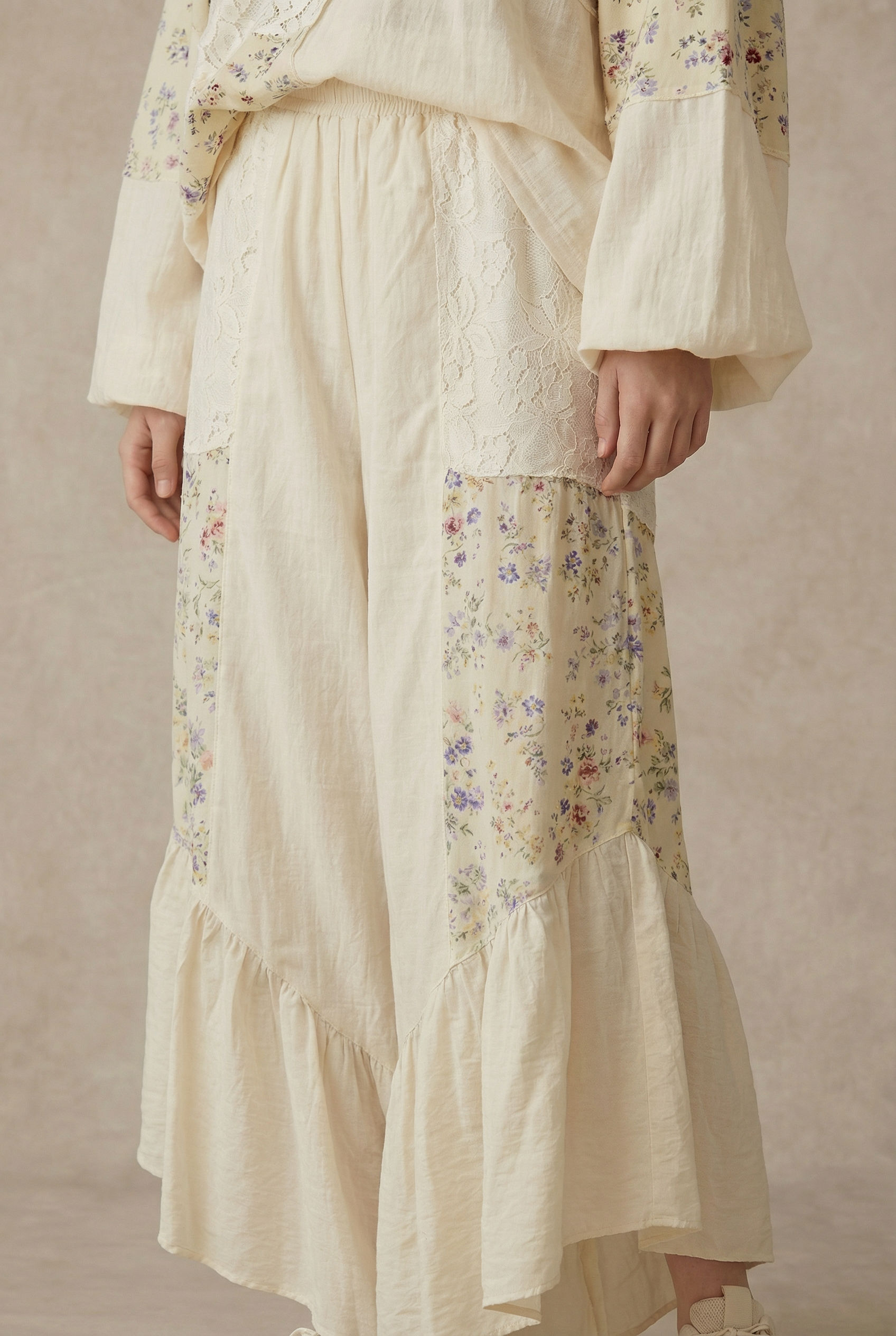 The Gypsy floral ruffle pants - front view showing artisan patchwork design with cascading ruffles and wide-leg silhouette