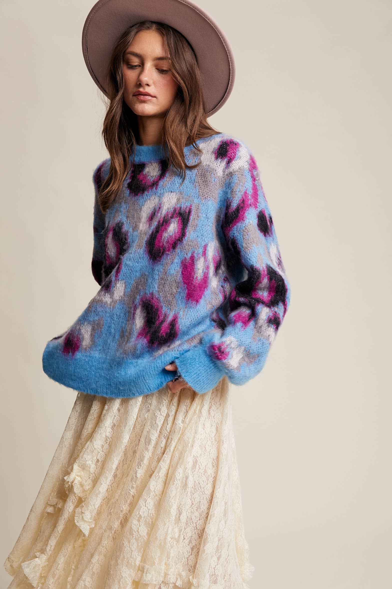 Partial Side View Women’s fuzzy abstract leopard knit pullover sweater with soft textured fabric and bold animal print — cozy statement top for modern chic outfits.