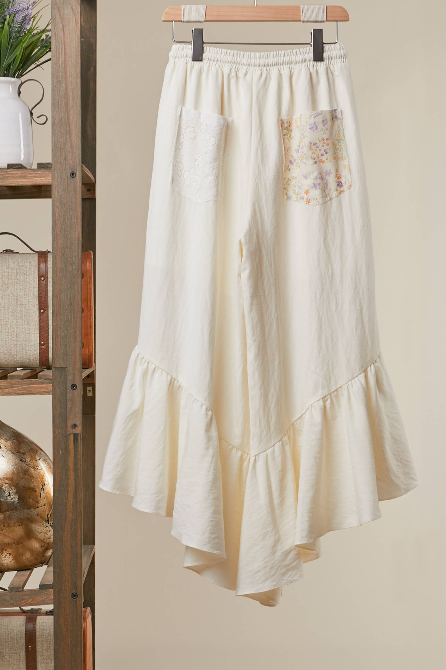 Boho ruffle pants back view - wide-leg silhouette with artisanal floral patchwork construction