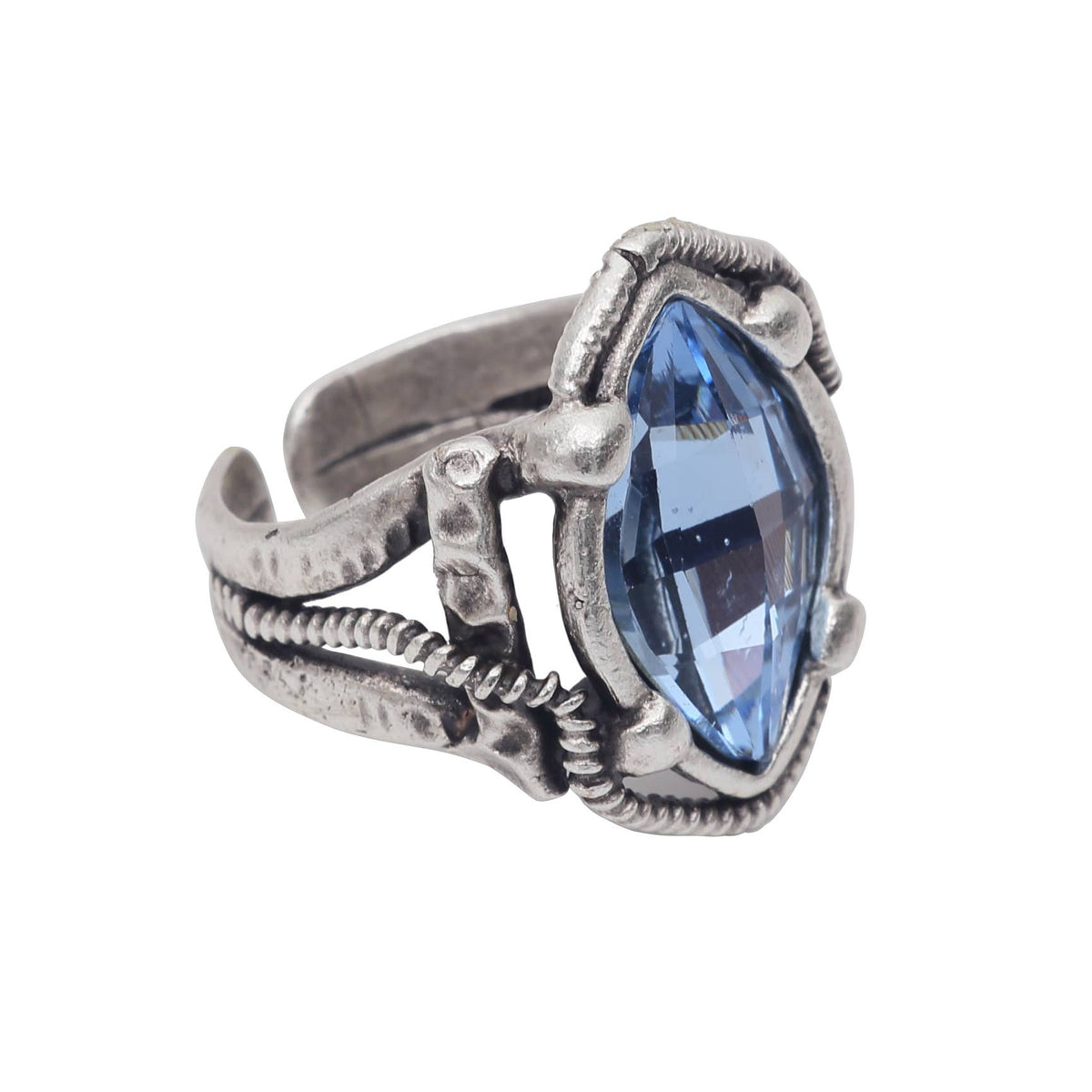 A silver-toned gothic-style ring featuring a large, faceted marquise-cut light blue gemstone in an ornate, textured setting with a split band design, shown on a plain white background.