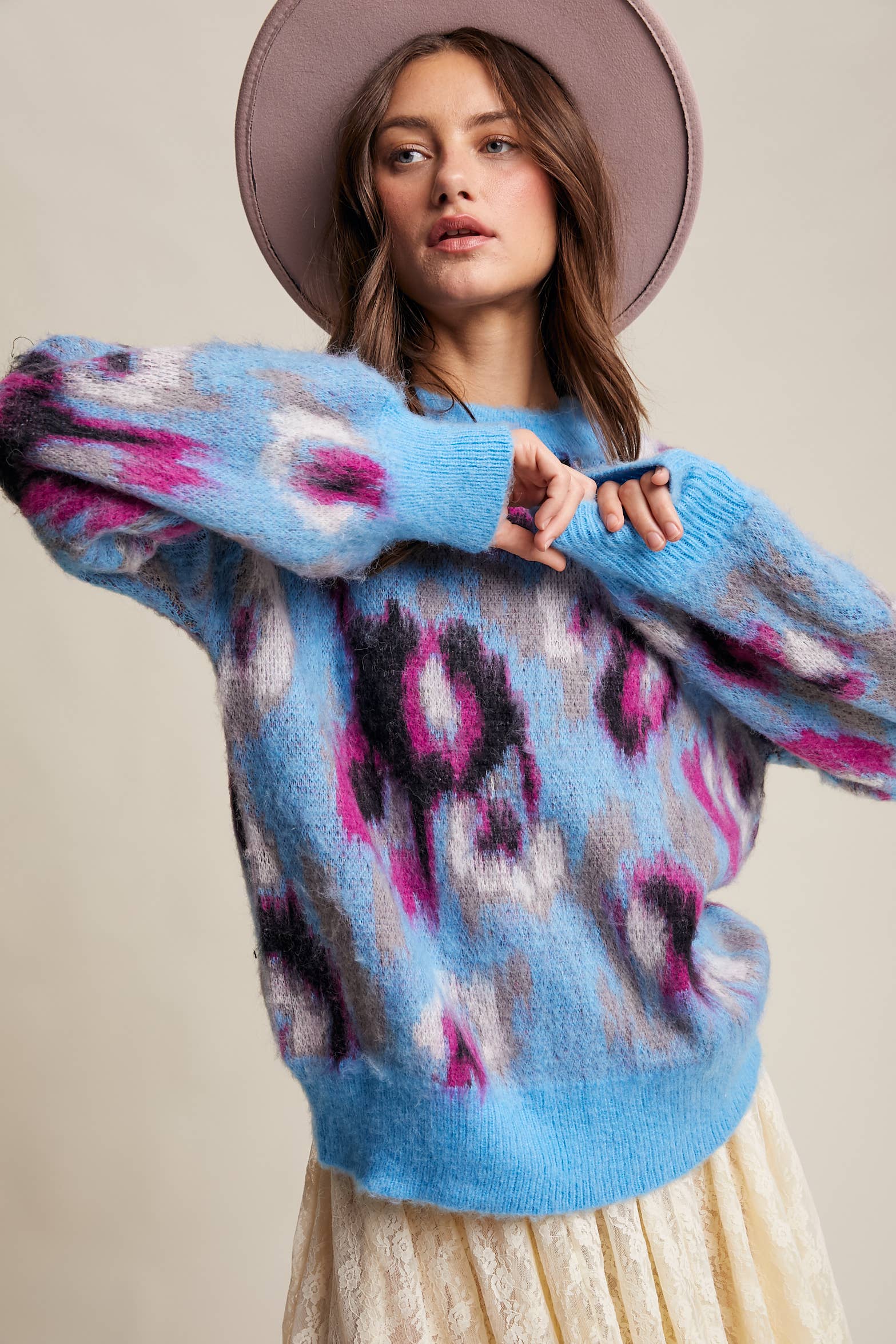 Women’s fuzzy abstract leopard knit pullover sweater with soft textured fabric and bold animal print — cozy statement top for modern chic outfits.