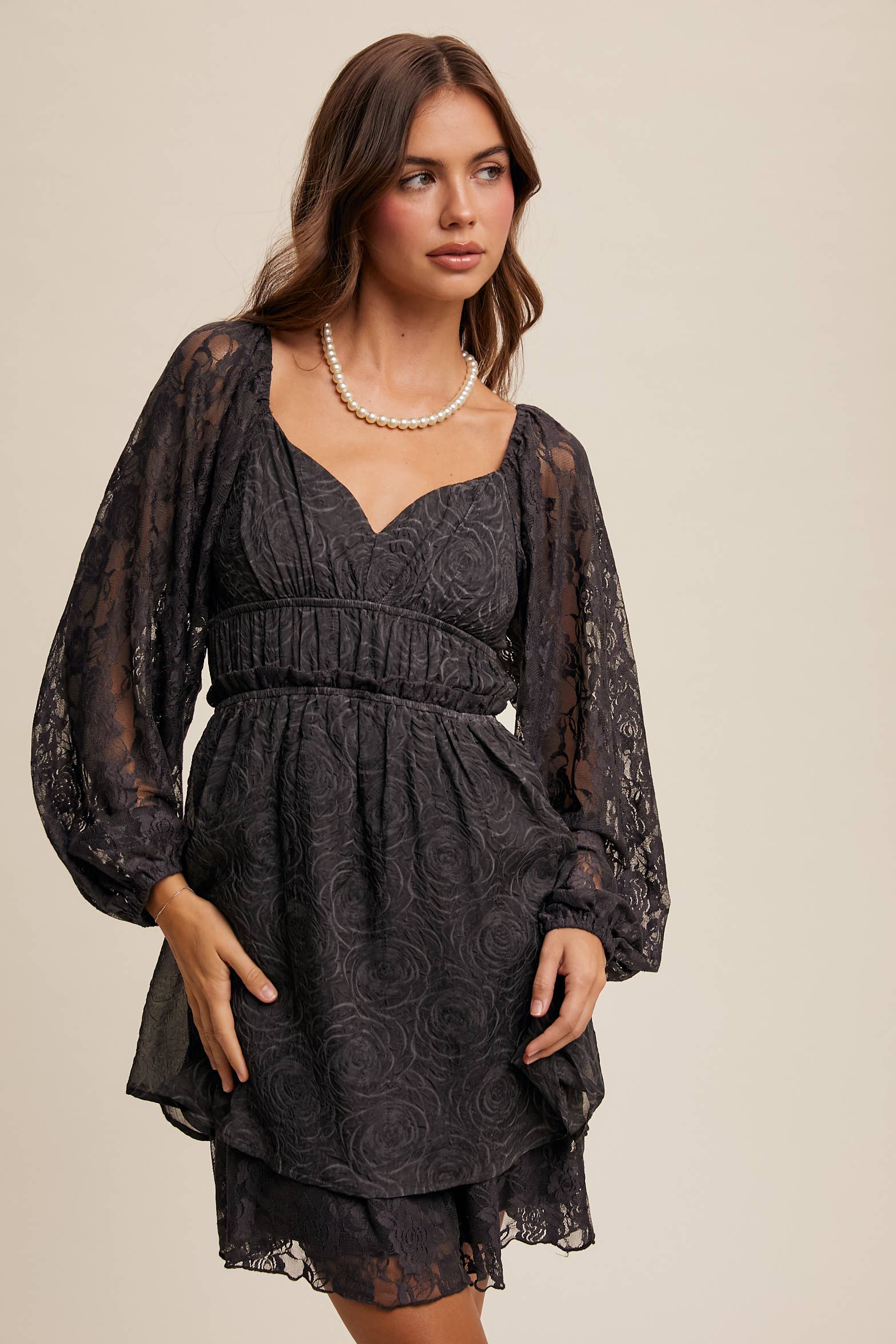 Close-up of floral lace detailing and layered hem on The Midnight Lace Dress