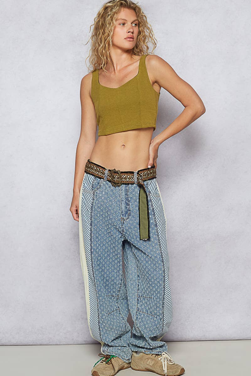 Golden embroidered belt with vintage-style buckle, paired with high-waisted patchwork denim.