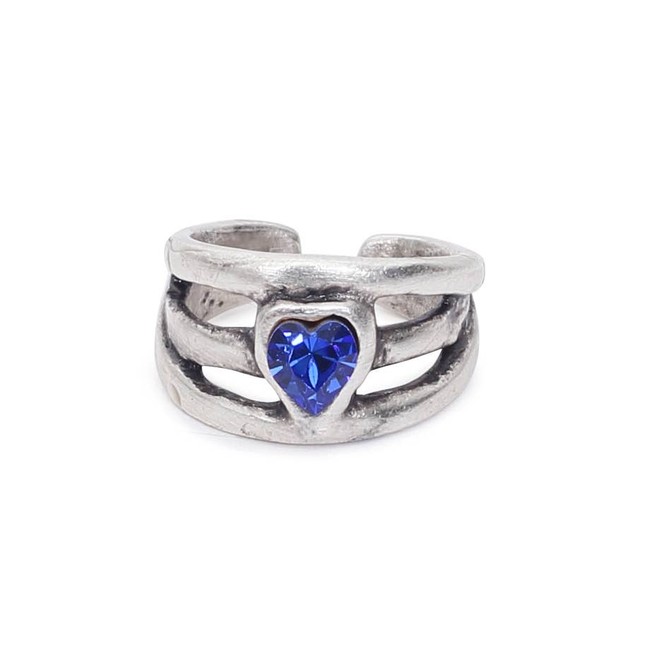 Silver ring with a blue heart-shaped gemstone on a white background