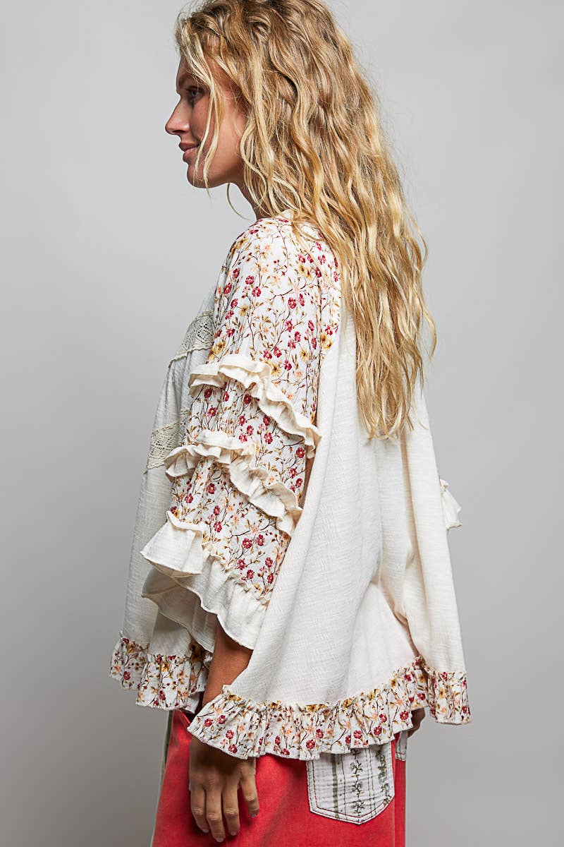 Tina's Boho Floral Lace Top in Natural – side profile view showing tiered pink floral ruffle sleeves and floral smocked hem detail