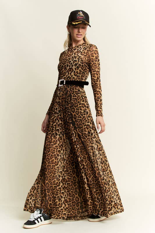 Side view of a leopard-print long-sleeve mesh maxi dress with a sheer, flowy skirt, styled with a black belt, baseball cap, and black-and-white sneakers.