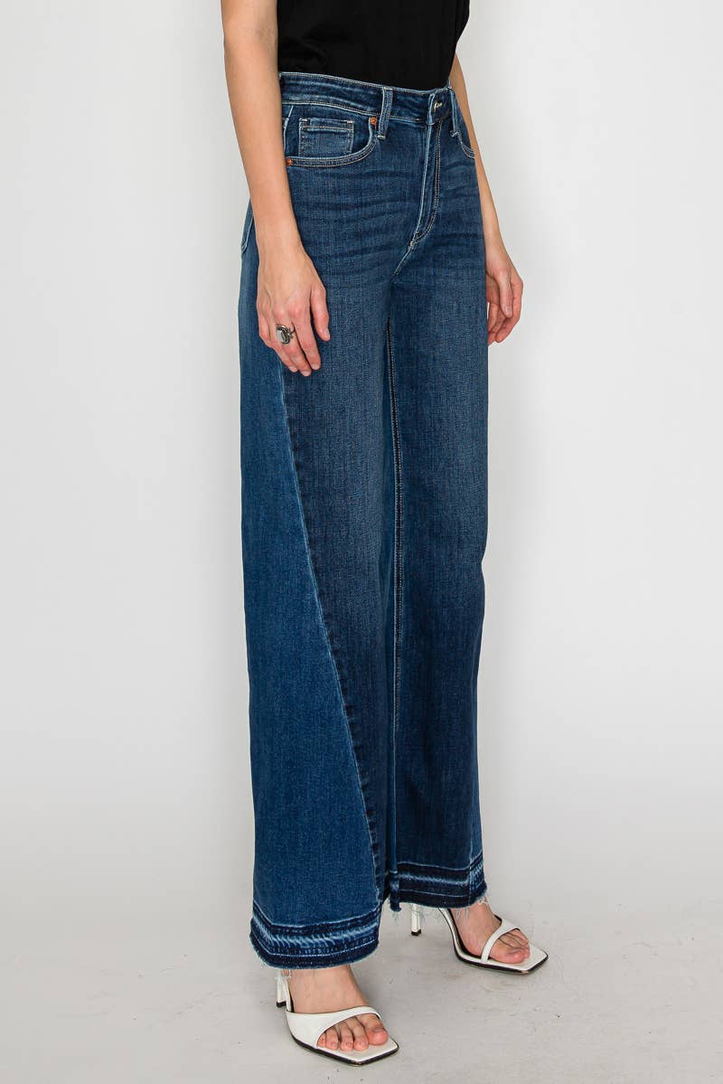The Bridget jeans styled - dark stone wash flare jeans with modern dimension and polished hem detail