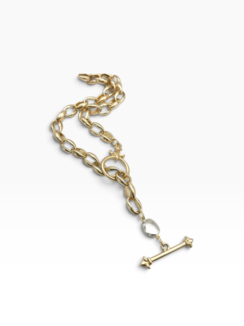 A gold chain necklace with a decorative T-bar pendant and a small clear faceted accent stone, displayed on a clean white background.