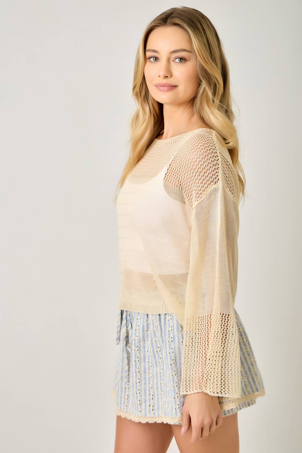 The Barely There Knit in Oatmeal - side view highlighting boat neckline