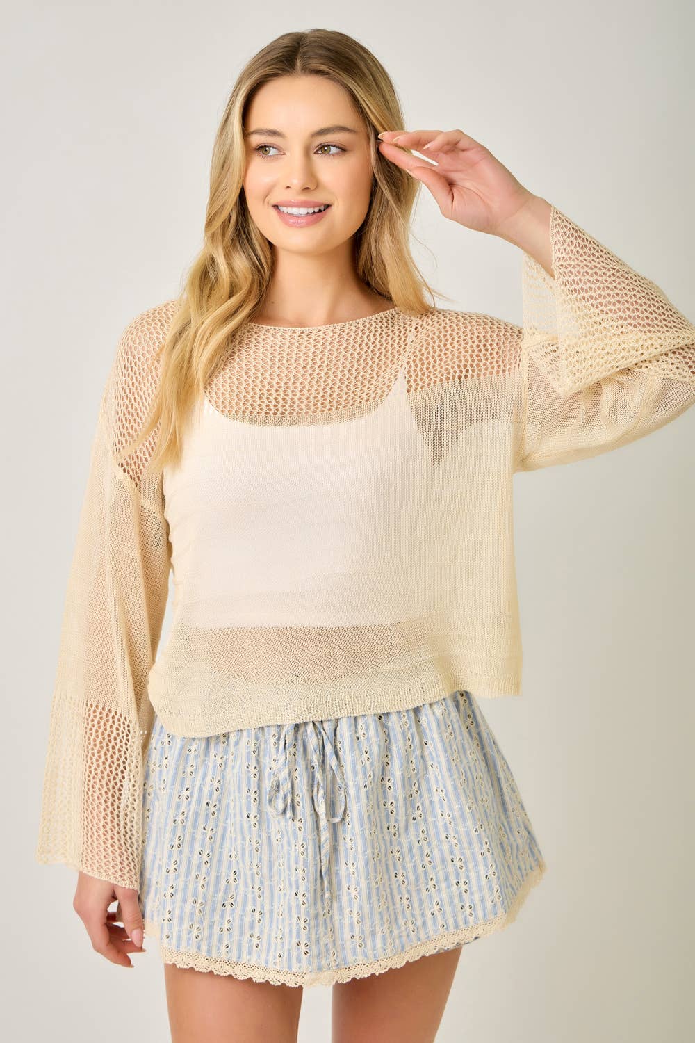 The Barely There Knit in Oatmeal - styled layering shot showing versatile design