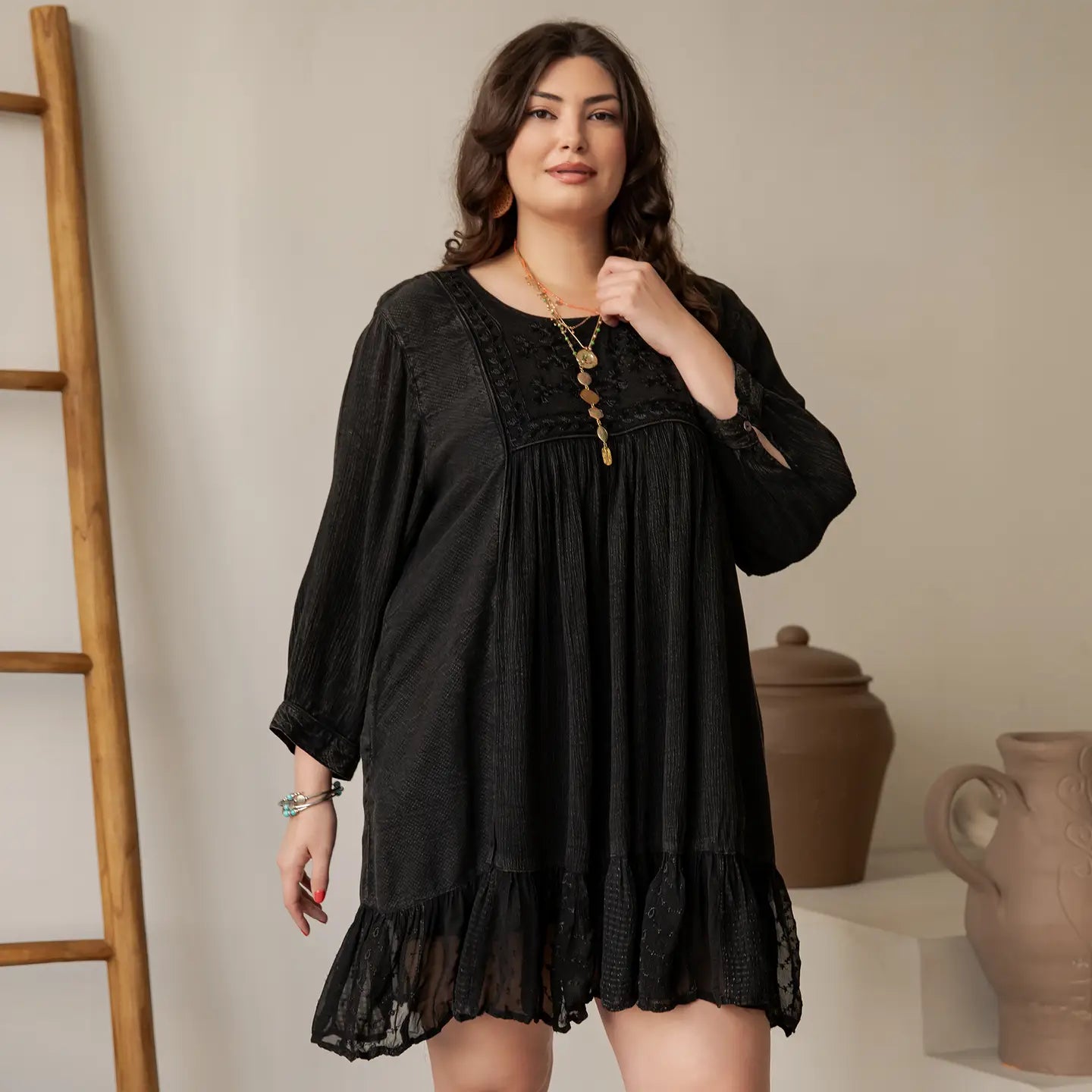 Plus size black aari-embroidered babydoll dress in soft rayon crepe with 3/4 sleeves and lace ruffle hem