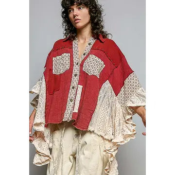 Crochet Lace Ruffle Gauze Shirt in Red – front view, red gauze body with cream floral print patch pockets, stud trim, and cascading cream crochet lace ruffle sleeves, styled with khaki wide-leg pants