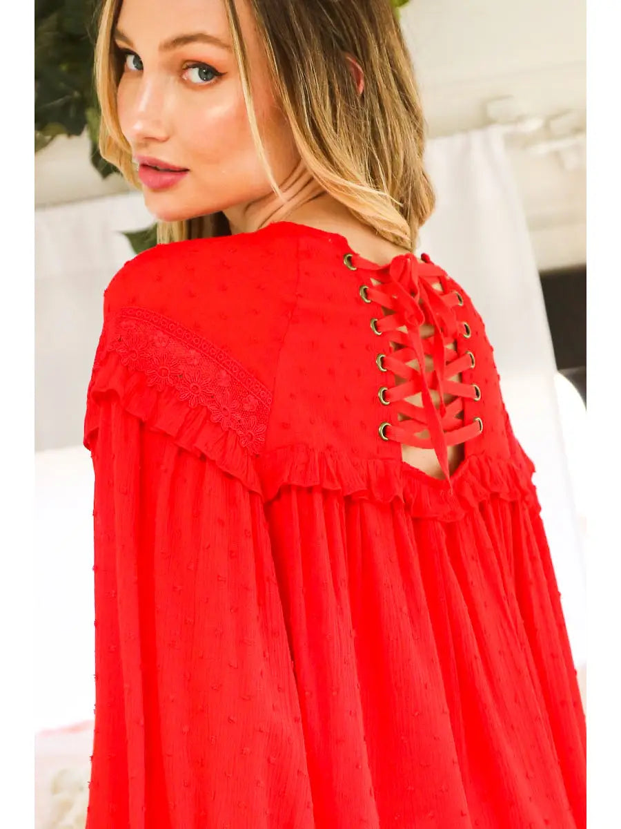 Close-up of lace-up eyelet back detail on red Swiss dot blouse with crochet ruffle yoke — Spirit & Wind Boutique