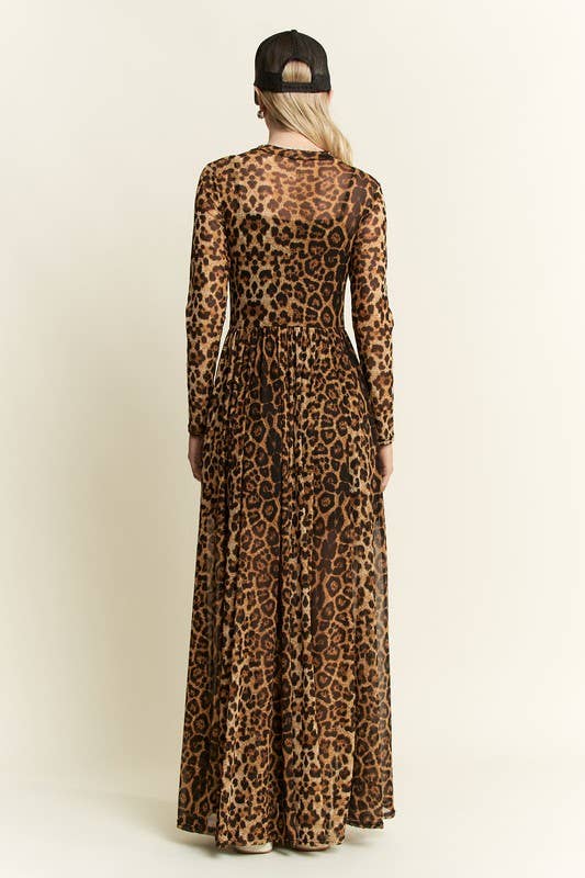 Back view of a leopard-print long-sleeve mesh maxi dress with a sheer, flowy skirt and elastic waist, styled with a black baseball cap.