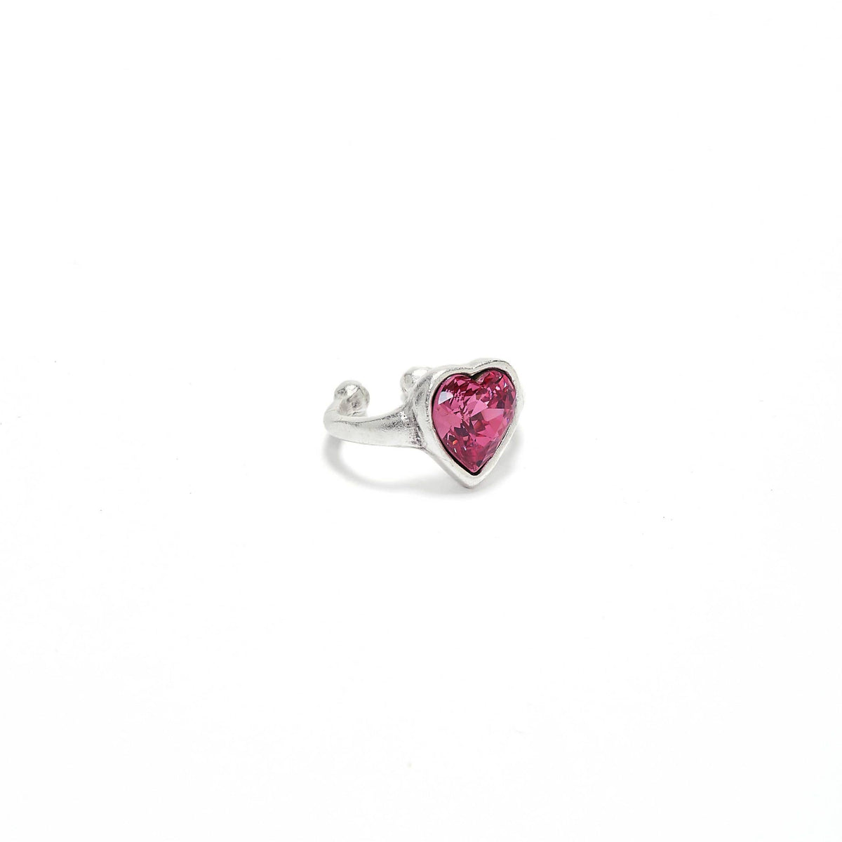 Silver ring with a pink heart-shaped gemstone on a white background