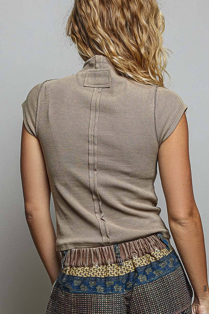 Back view of taupe vintage wash mock neck rib knit top showing center seam detail and slim fit silhouette