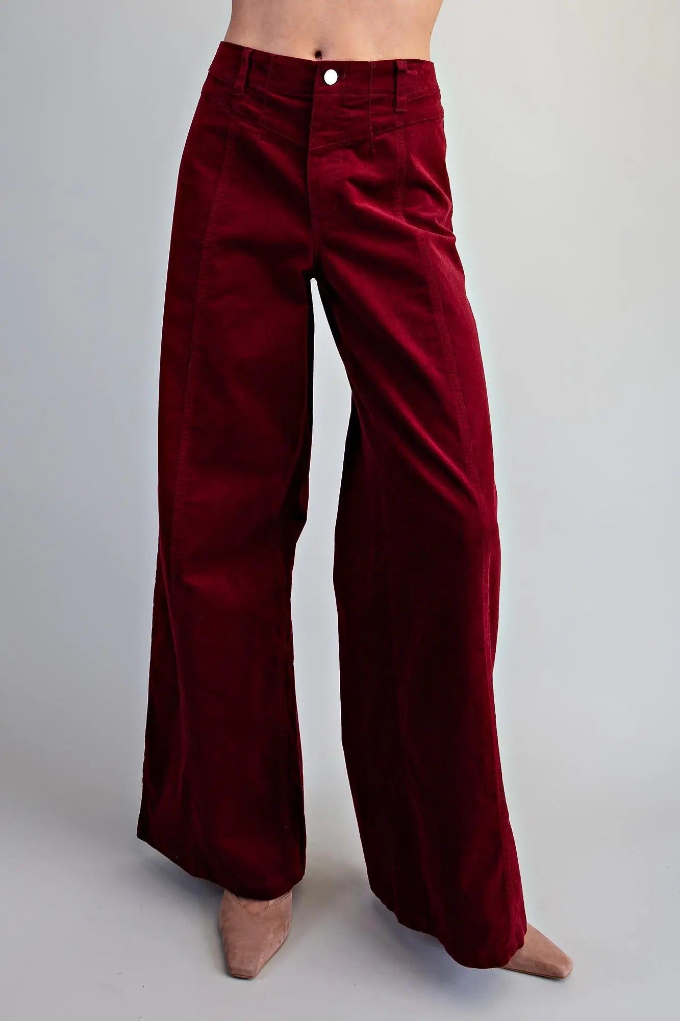 Front view of women's crimson high-rise wide-leg corduroy pants with single button closure, shown from waist to ankle against a neutral gray background 