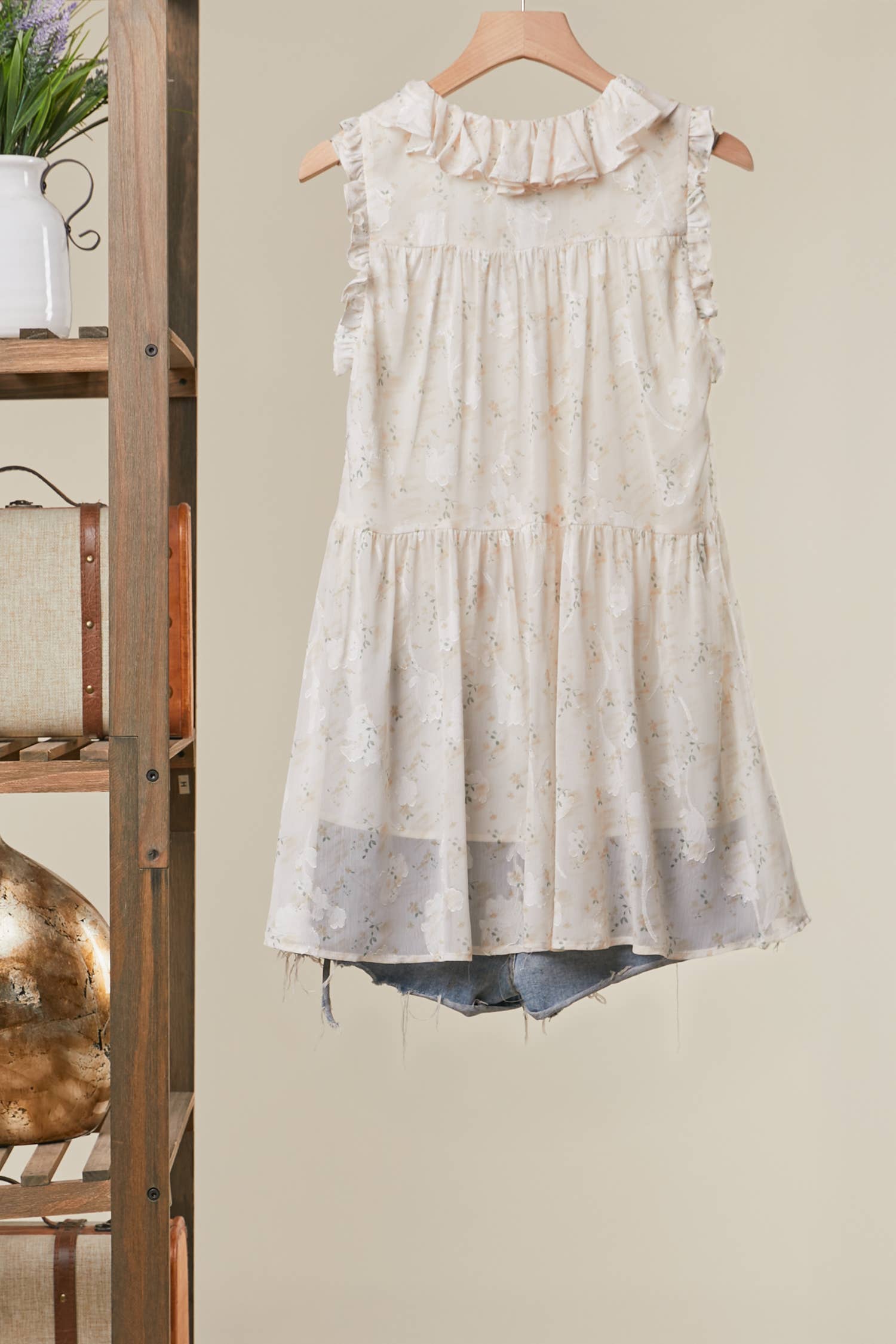 Ruffled tunic in white back view - flattering flowing design with feminine detailing

