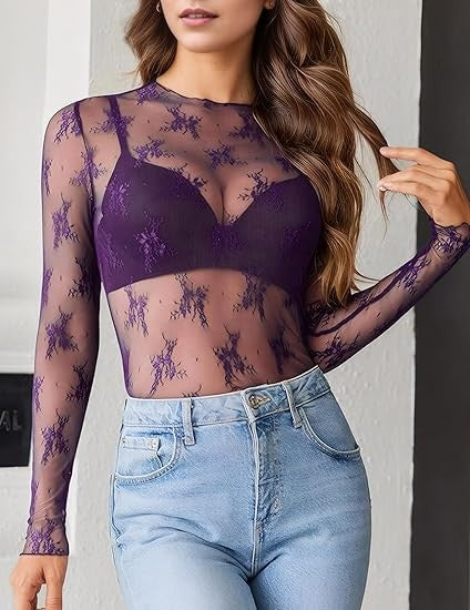 Sheer purple lace mesh long-sleeve top layered over matching bralette, styled with light-wash high-rise jeans.