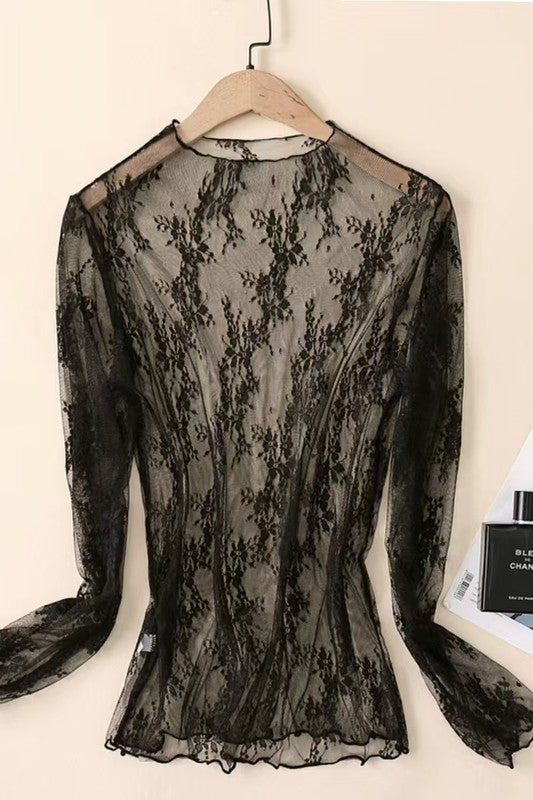 Sheer Black lace sleeveless tops in assorted colors including black, taupe, rust, white, pink, gray, and beige, folded neatly on a flat surface.